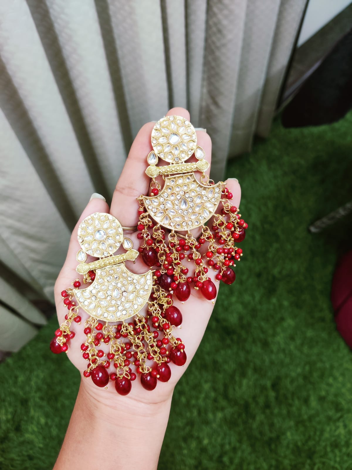 Shop Traditional Elegance with Jaipuri Kundan Jhumki Style Dangler Earrings in Red.&nbsp; Crafted with intricate detailing, these stunning earrings add a royal touch to any outfit. Perfect for festive occasions and weddings.