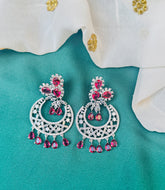 Woman wearing elegant party wear earrings
